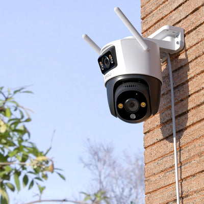IMOU Cruiser Dual 2 mounted on a wooden exterior wall