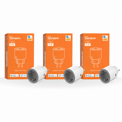 Three orange Sonoff digital smart plug boxes arranged side by side, with two white and gray smart plugs displayed in front on a clean white background.
