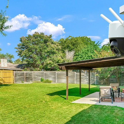IMOU Cruiser SC 8MP PT camera mounted on a house overlooking a backyard