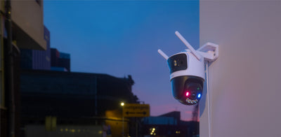 IMOU Cruiser Triple mounted on an exterior wall at dusk